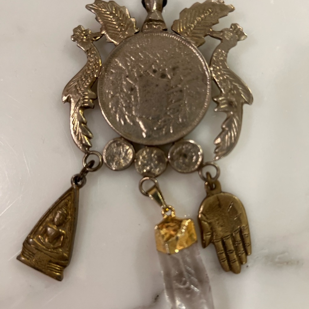 COIN NECKLACE WITH CRYSTAL, COINS AND CHARMS.